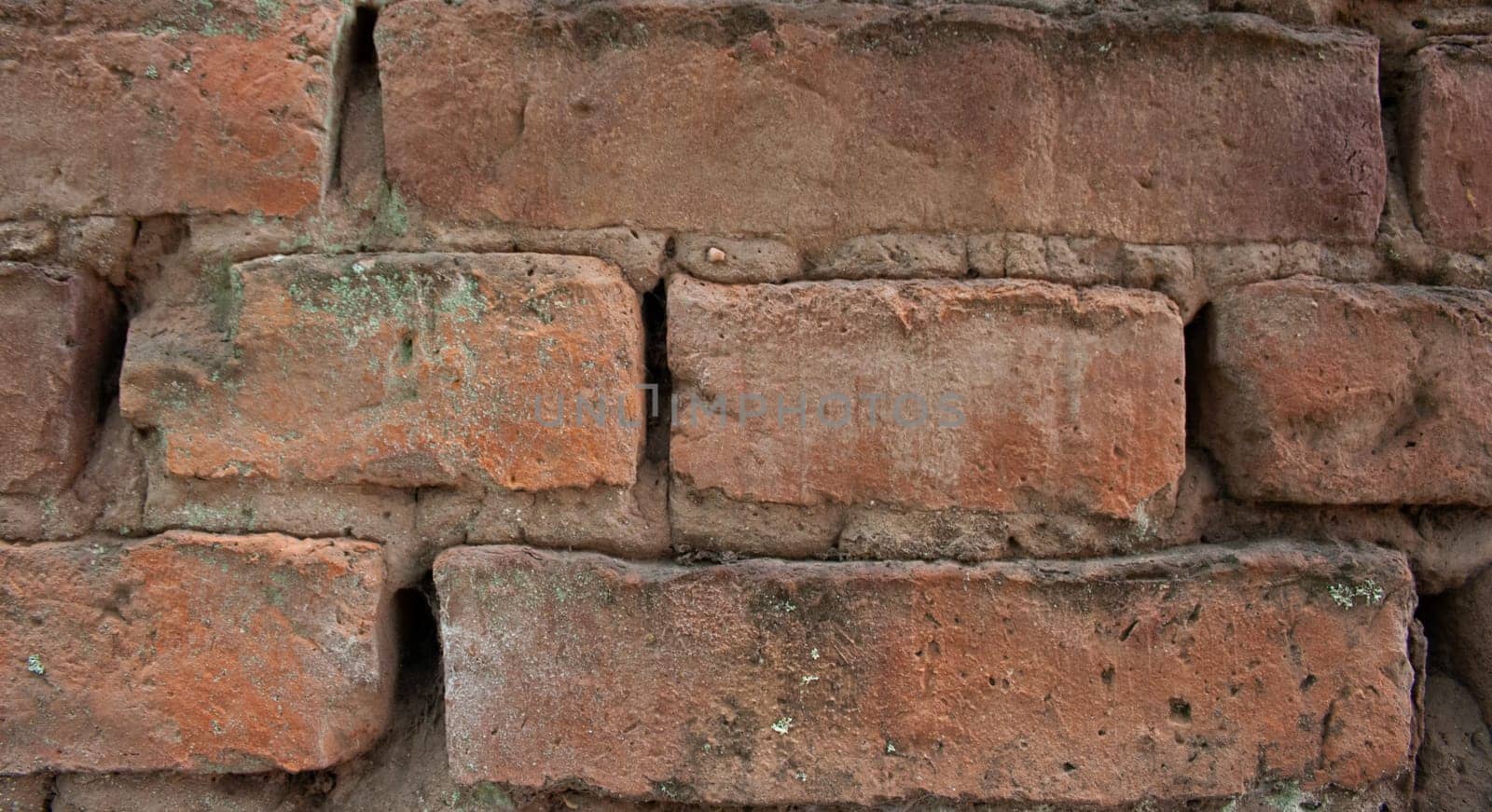 Very close up wall background with stained aged bricks by VeroDibe