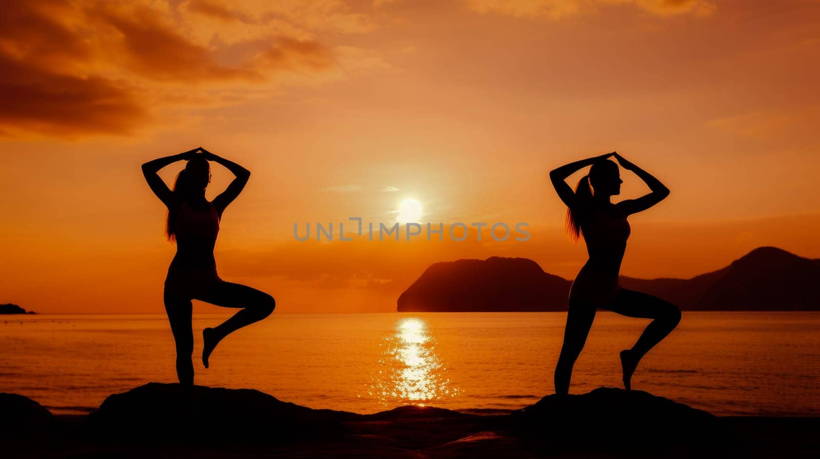 Woman girl happy smiling white Caucasian doing sports and yoga on the ocean shore against the backdrop of the sun, uniting with nature. by Alla_Yurtayeva