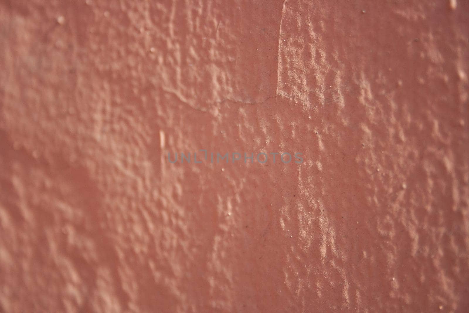 Old textured urban background in peach fuzz color. Copy space by VeroDibe