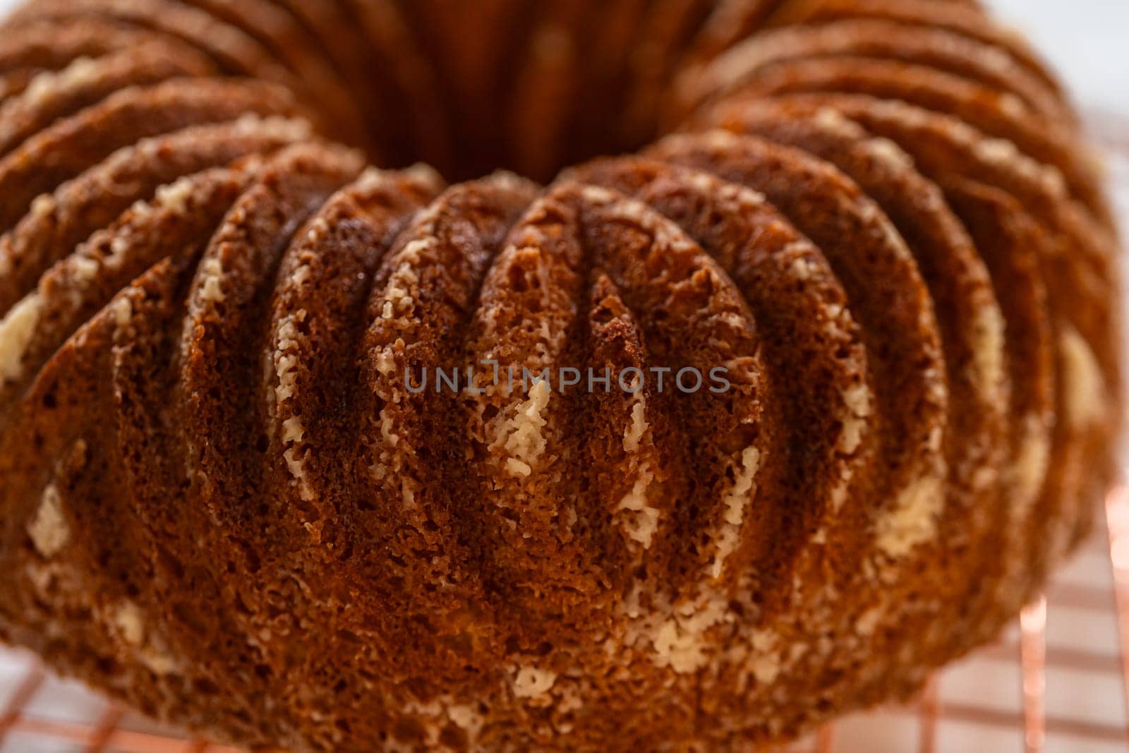 The artful extraction of the freshly baked bundt cake from its mold marks the exciting conclusion of the baking process.