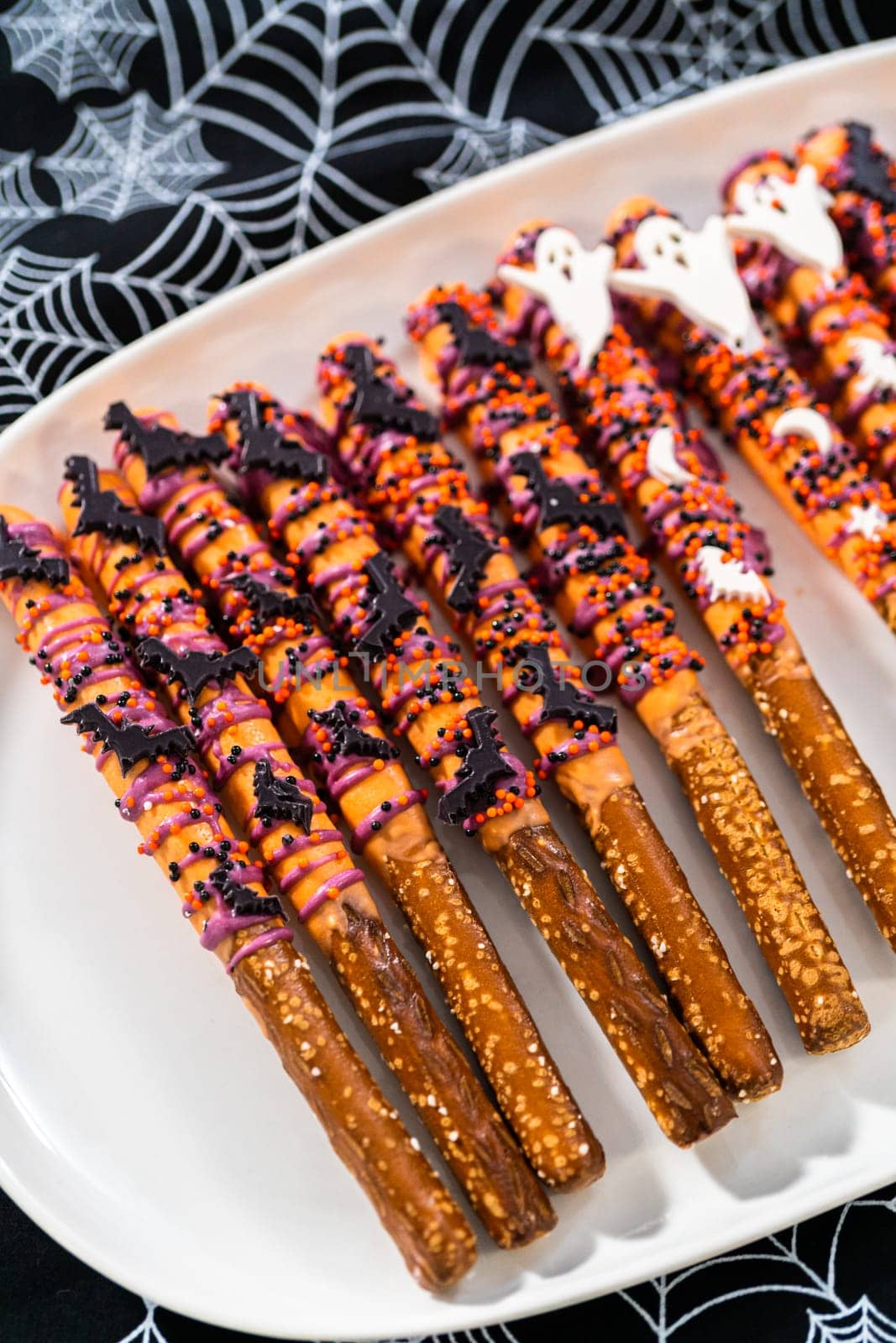 Halloween chocolate-covered pretzel rods by arinahabich