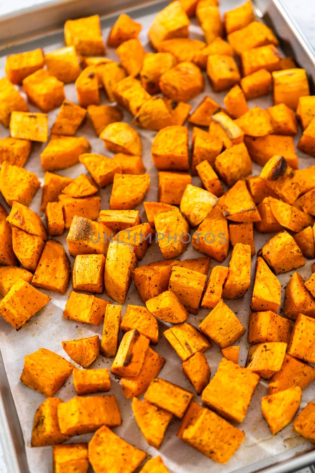 Flat lay. Cooling roasted sweet potatoes on a kitchen counter.