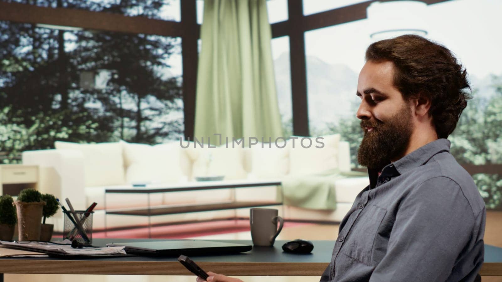 Successful billionaire sitting at his desk in luxury forest villa, relaxed rich person investing money in business. Wealthy person living in a modern cabin in the mountains, browses internet.