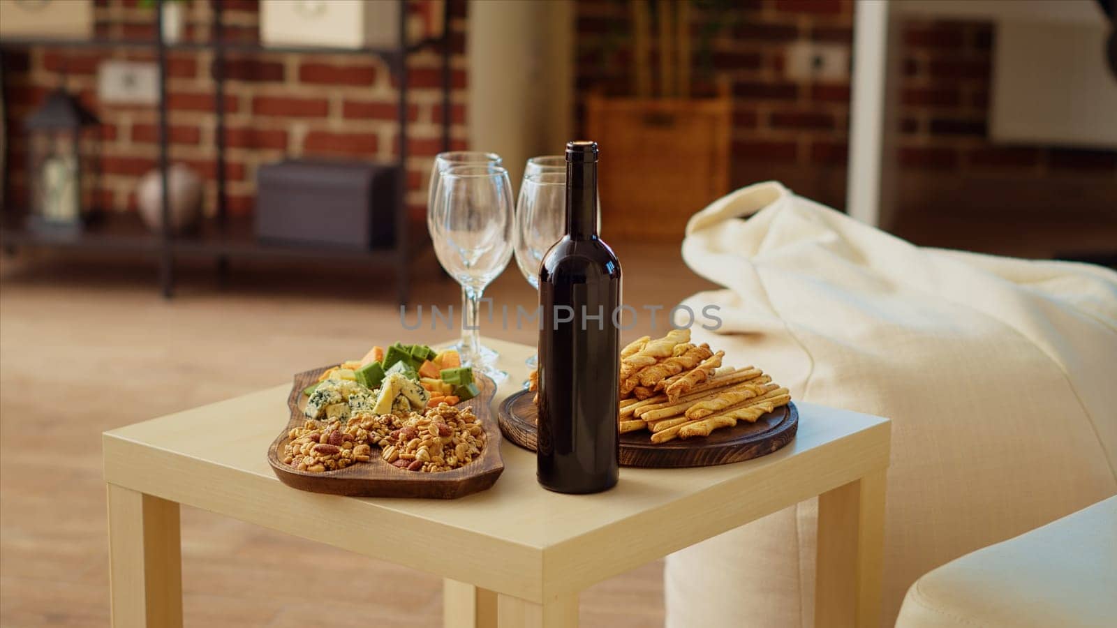 Panning shot of appetizers board and gourmet cheese platter set up by hosts to welcome guests by DCStudio