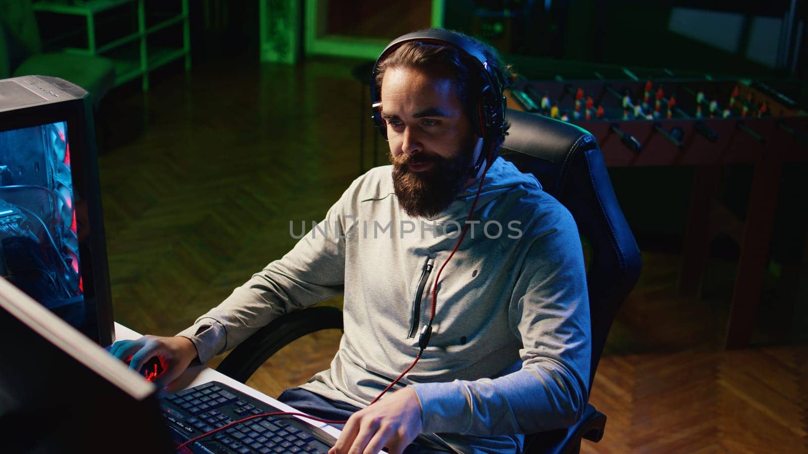 Gamer discussing with teammates while playing competitive esports tournament, finding best strategy. Player spending time together with friends in videogame, communicating through headset mic