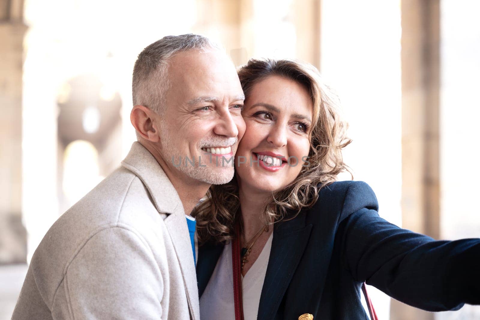 Smiling caucasian woman and man taking a selfie outside. Concepts of vitality, people's lifestyle, diversity, urban life