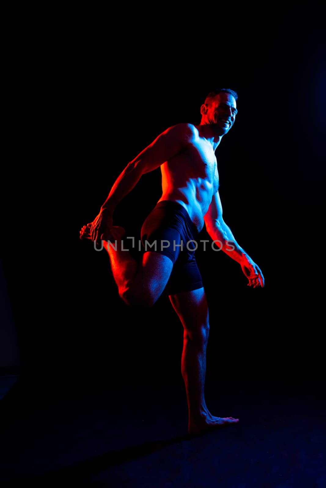 Portrait of man, bodybuilder and bicep flex in a studio, background and exercise for muscular power.