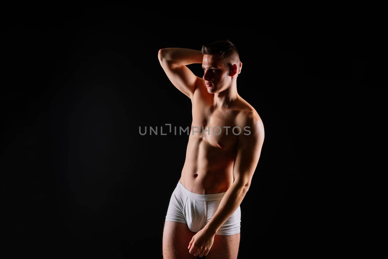 Portrait of man, bodybuilder and bicep flex in a studio, background and exercise for muscular power.