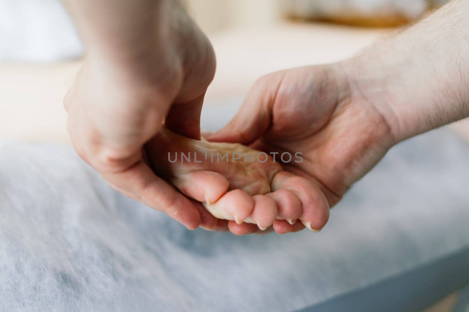 Anti-cellulite foot massage for fat woman. Concept of personal care, weight loss, diet. Close-up.