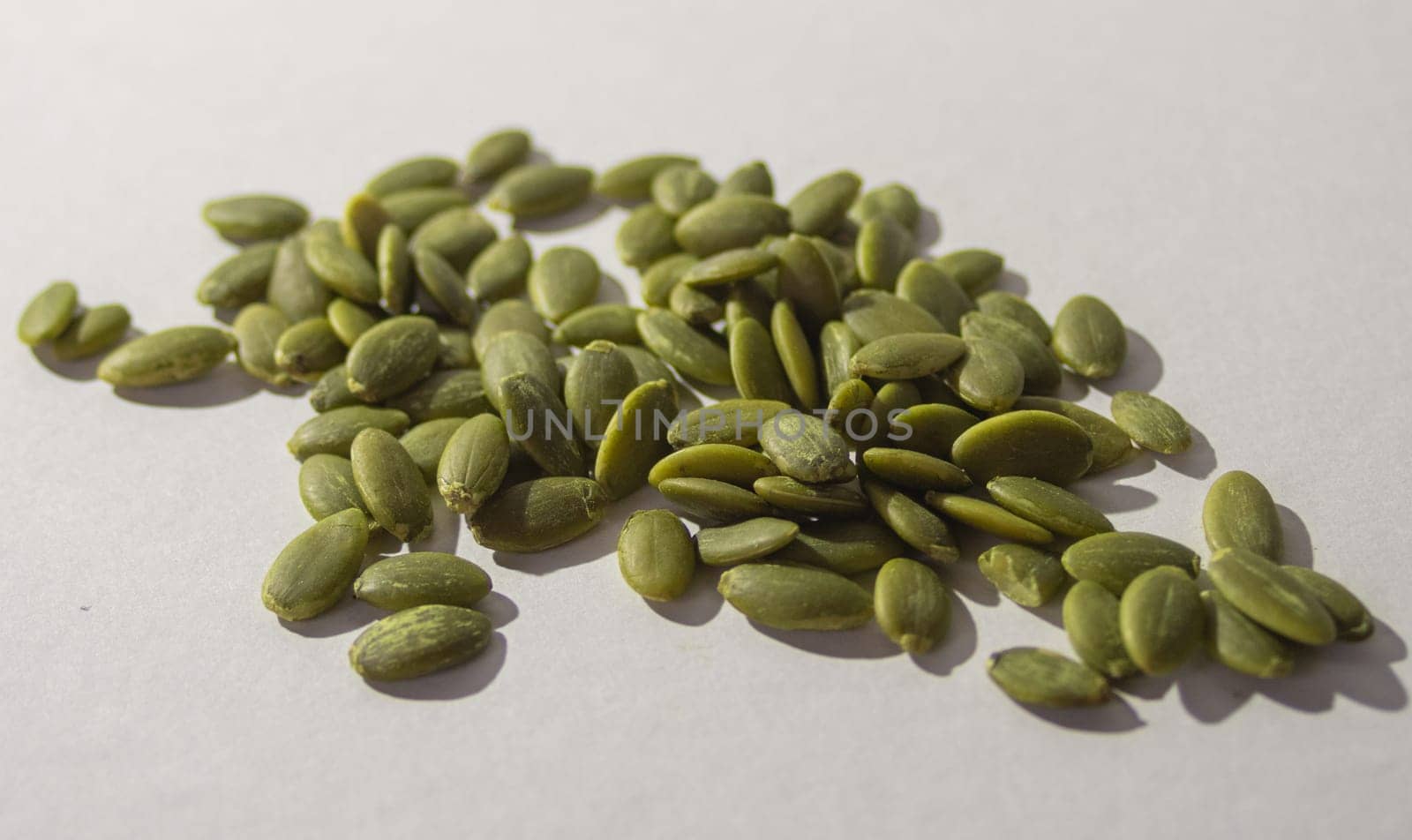 Pumpkin seeds isolated, with white background. Healthy seeds by VeroDibe