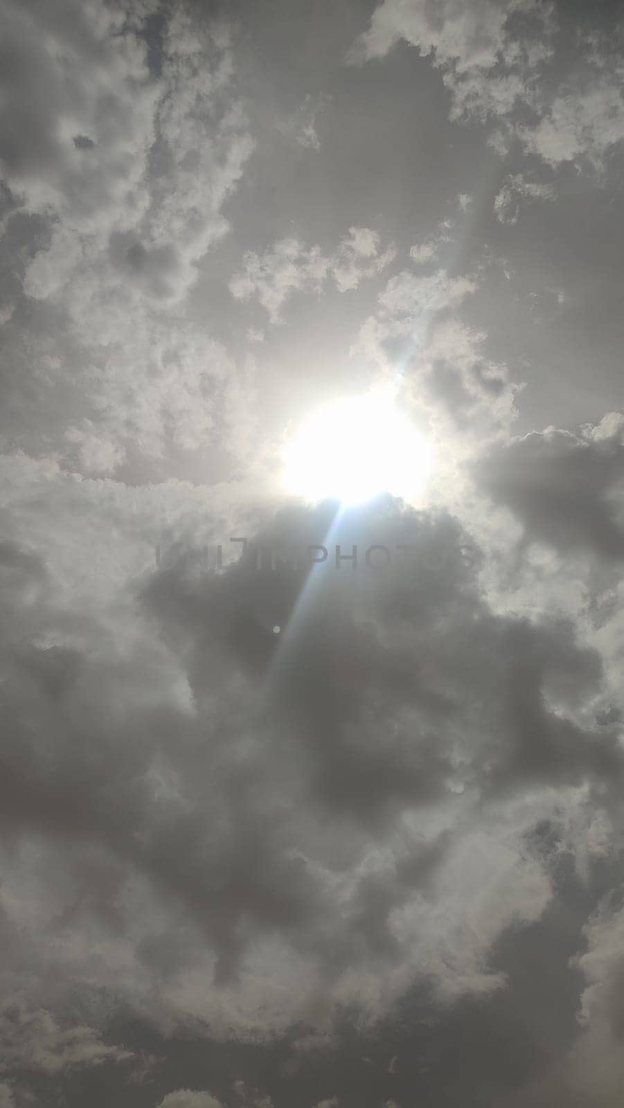 gray sky, clouds white sun, nature weather air background. High quality photo