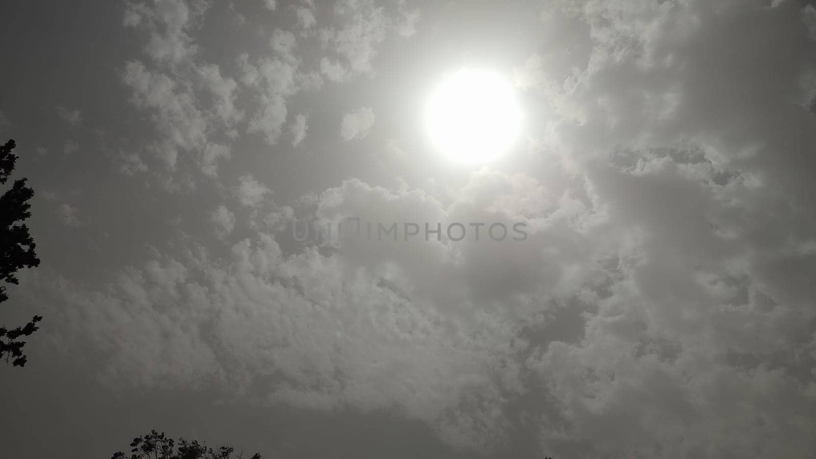 gray sky, clouds white sun, nature weather air background. High quality photo