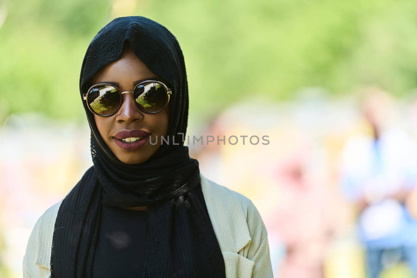 African American Muslim woman in hijab explores natural bee farms for honey production, blending tradition with sustainability in the serene countryside.