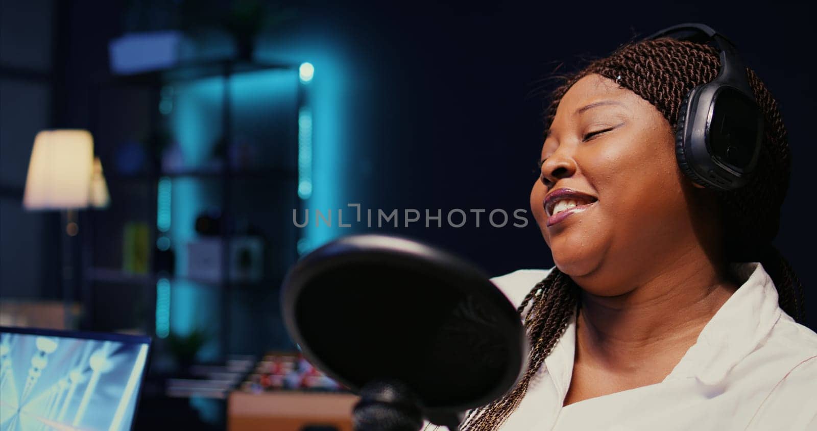 Internet show presenter in dimly lit studio, close up by DCStudio