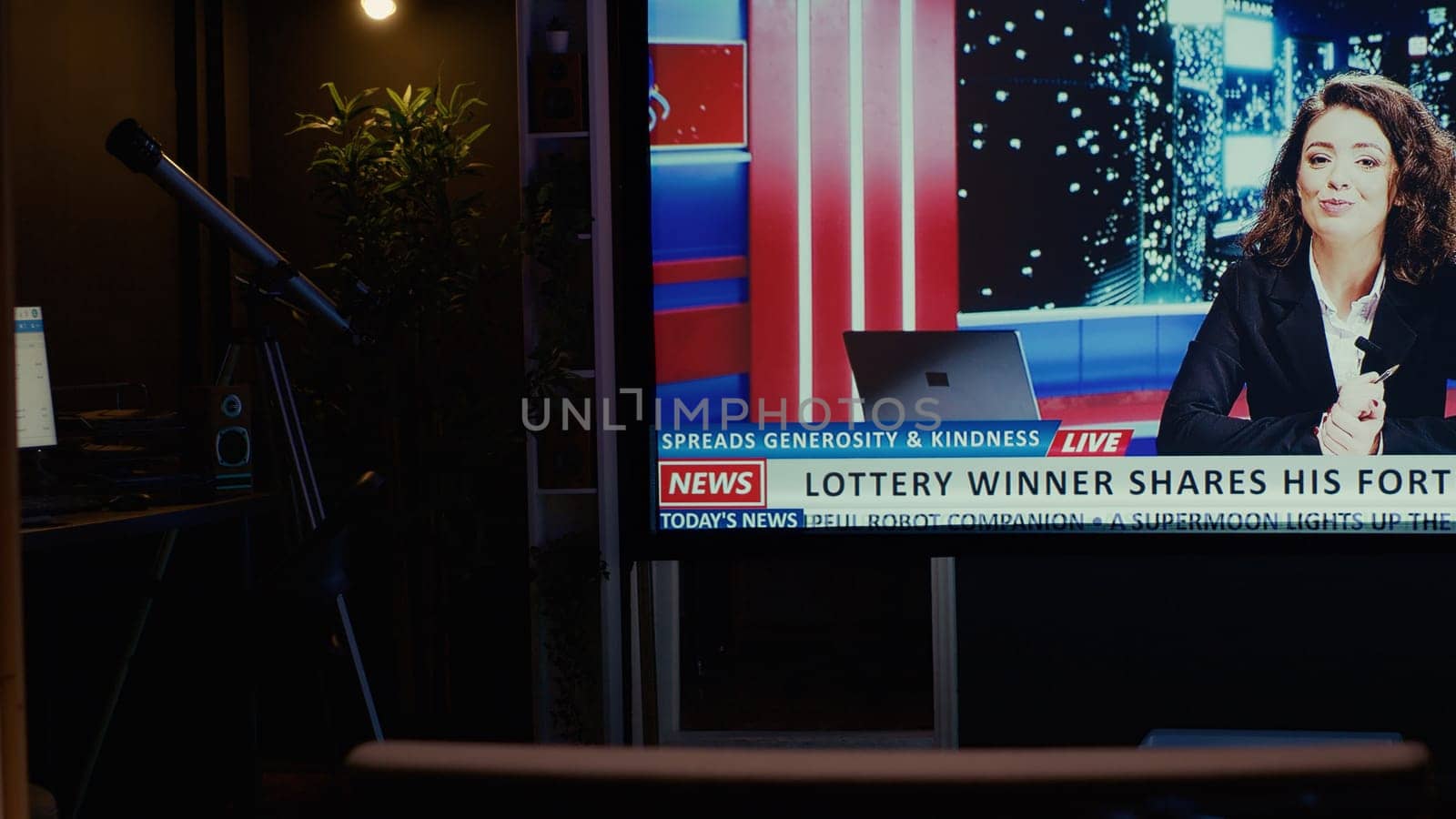 TV left open at night on streaming service channel with news reporter covering different subjects. Close up shot of smart TV in empty dimly lit apartment showing journalist talk about reportages