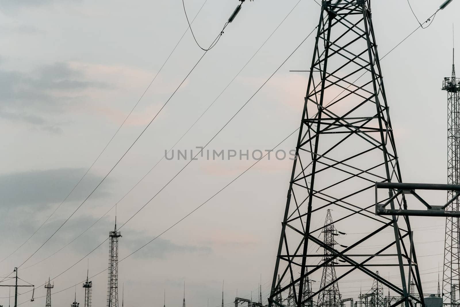 Power transmission lines on supports with ceramic insulators and transformers at large electrical distribution substation