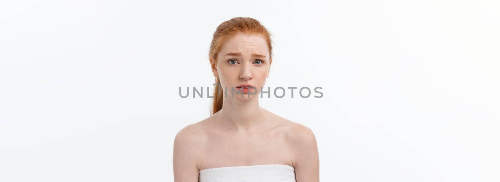 Portrait sad serious young woman with disappointed facial expression.. isolated on white background, looking at camera.