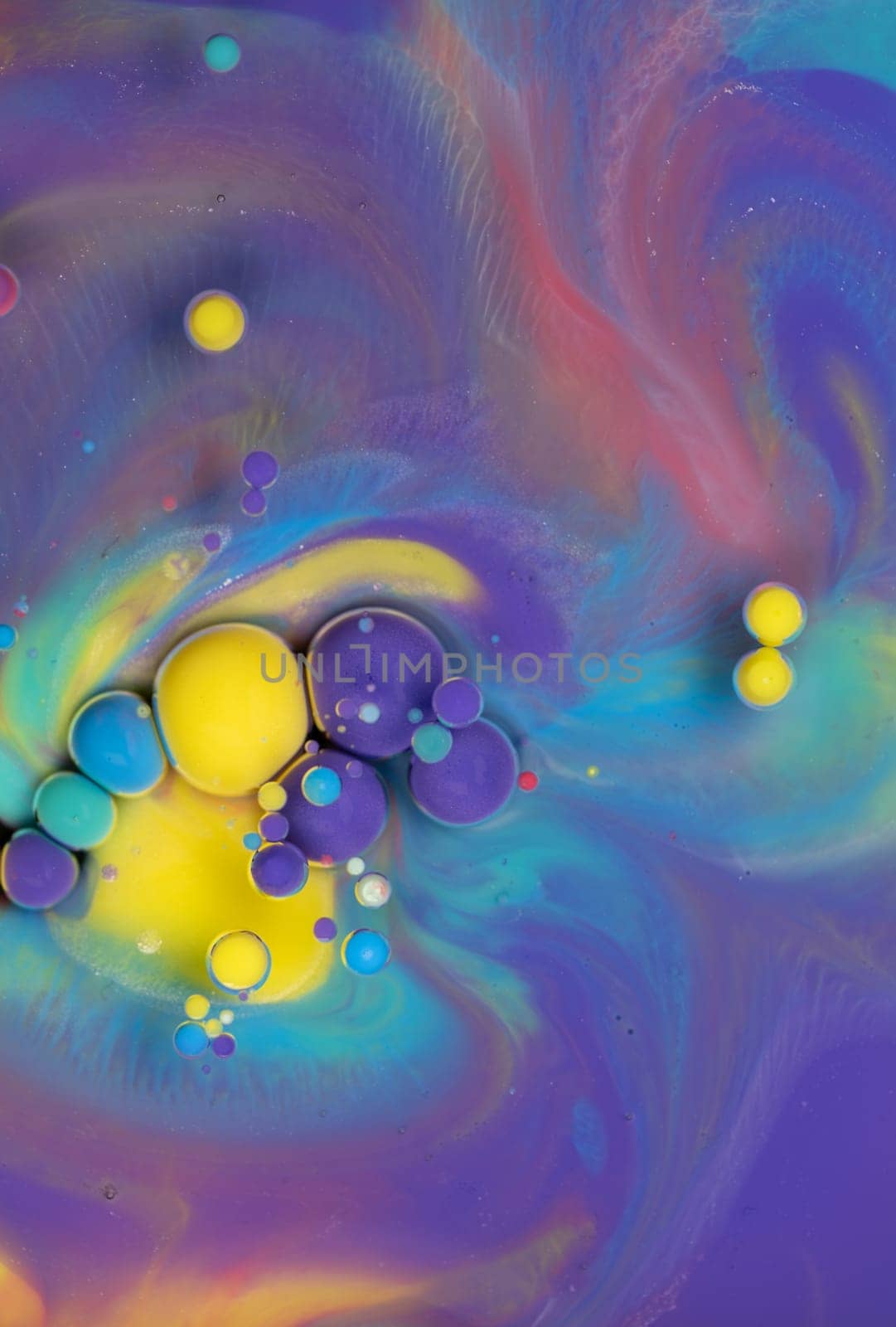 A Symphony of Spheres in Lavender HA close-up shot of vibrant, colorful spheres suspended in a lavender liquid, creating a mesmerizing abstract pattern.ues. High quality photo