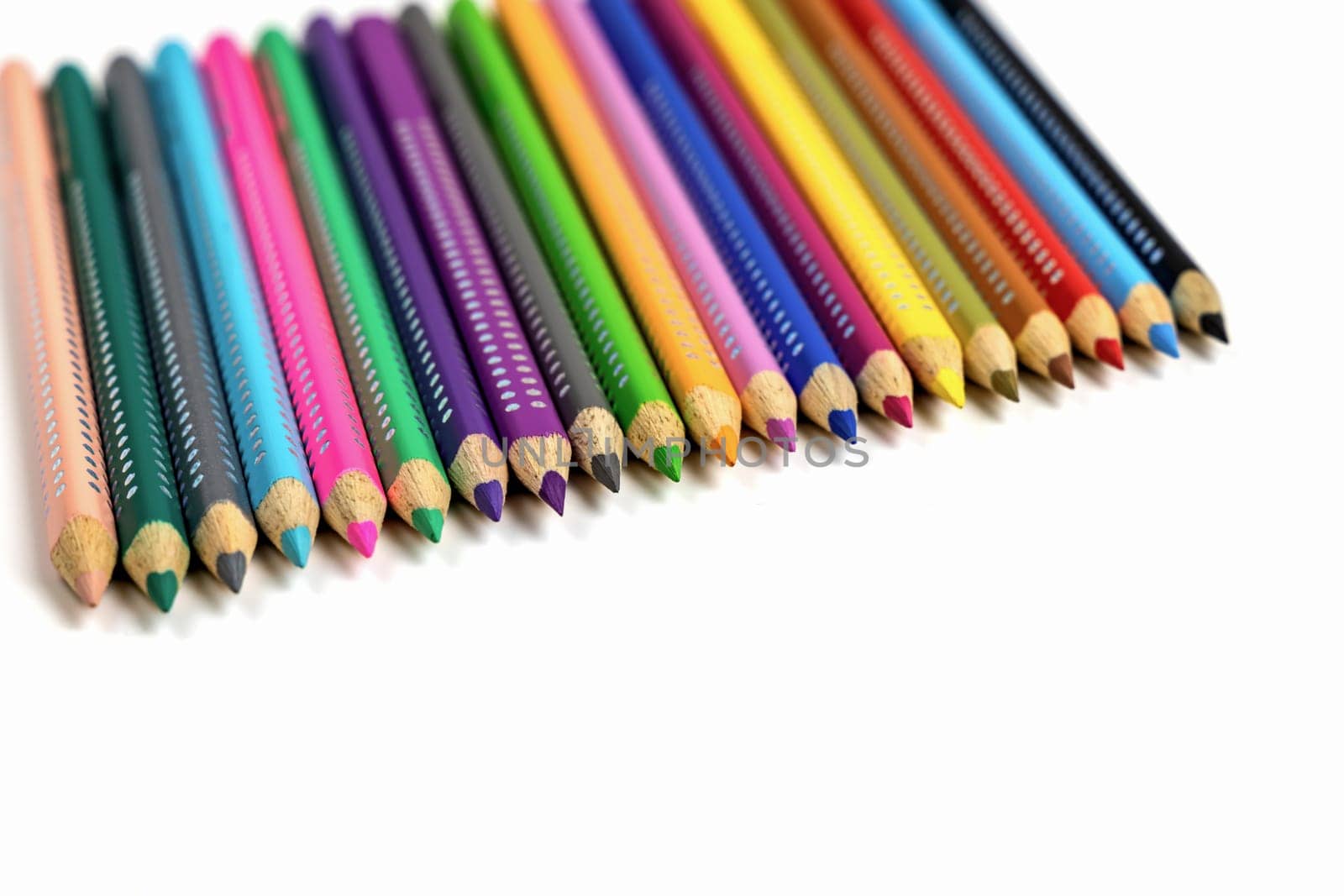 Colored pencils for drawing various colors andcoloring book for children. High quality photo