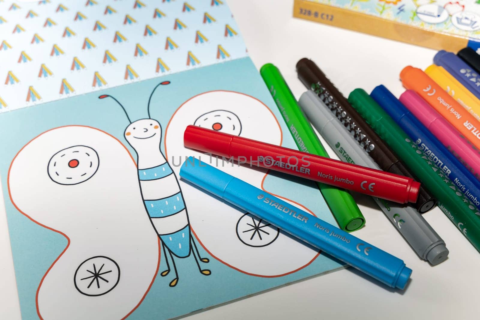 Colored markers for drawing various colors andcoloring book for children. Denmark - 9 February 2024