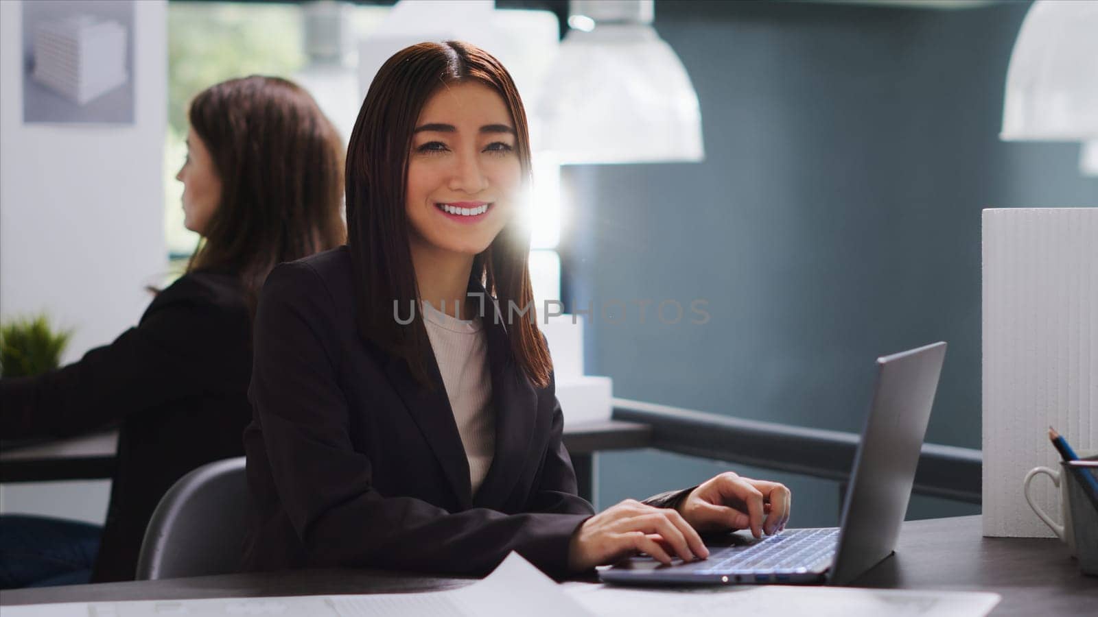 Portrait of asian creative employee working on interior design by DCStudio