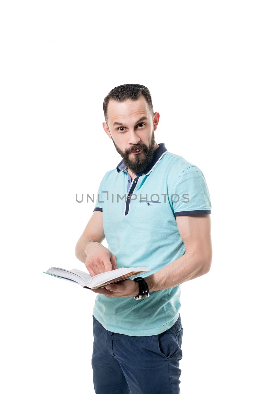 Man makes funny facial expression while reading book