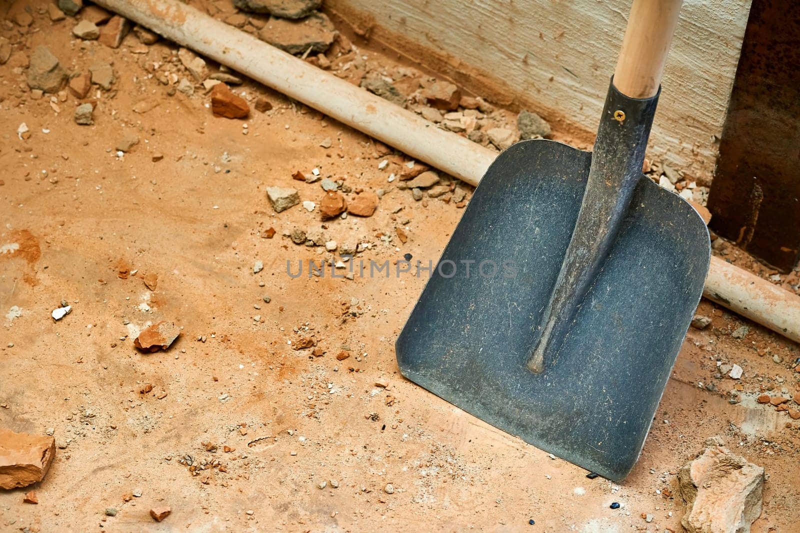 Scoop shovel on garbage collection at construction site, repair by jovani68