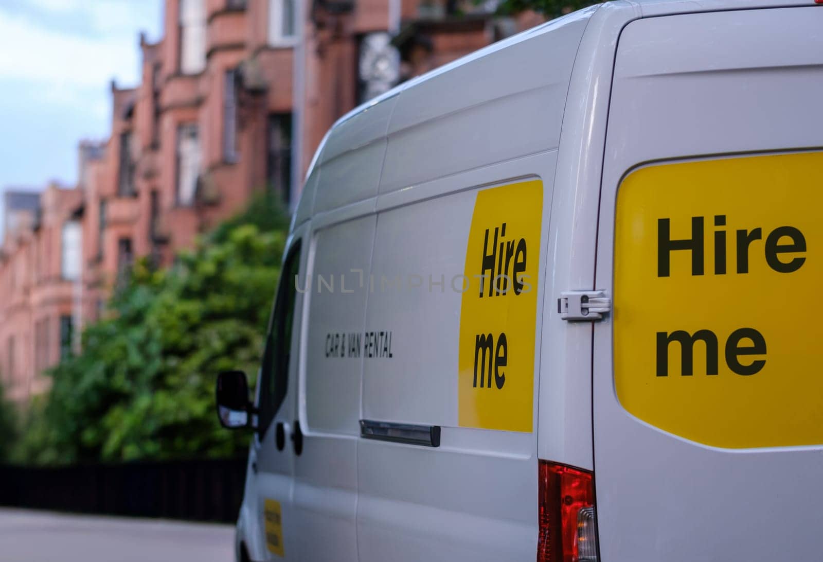 A Rental Van Or Truck With 'Hire Me' On The Side, Being Used To Move House Or Apartment In Glasgow, Scotland