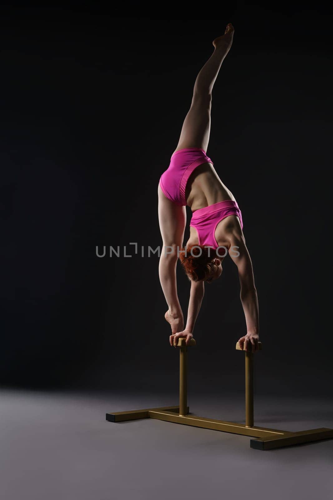 Tightrope walker training. Photo on gray background