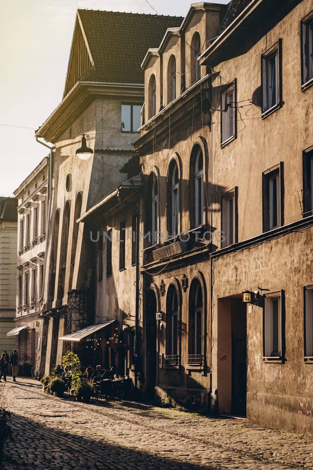 Old buildings facade and courtyard in Krakow at sunset, Poland by Popov