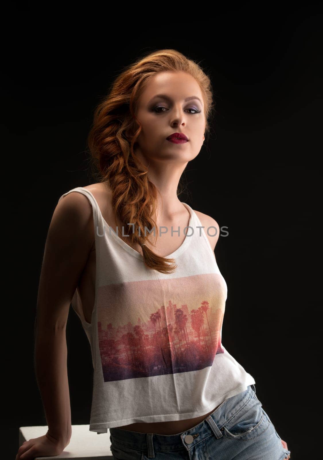 Erotica. Image of beautiful red-haired model with fishtail braid