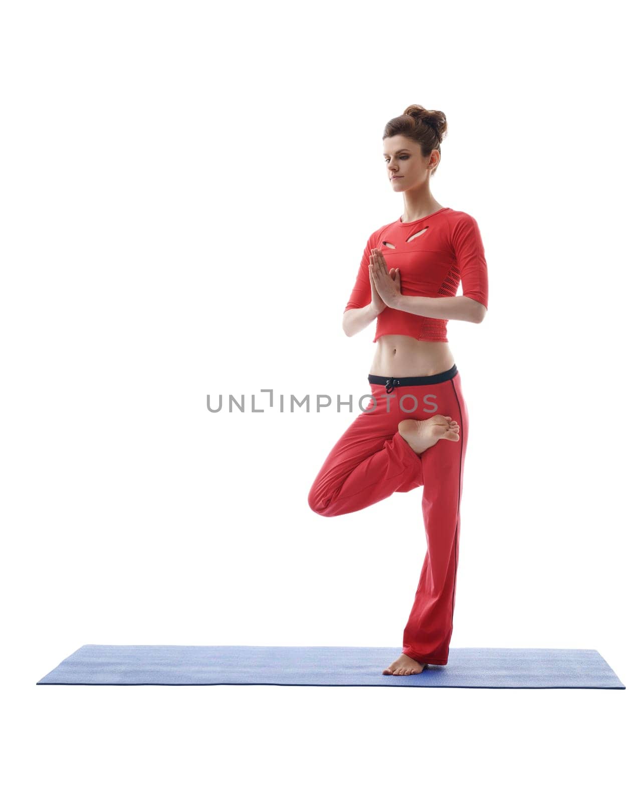 Image of yoga instructor posing while standing on one leg