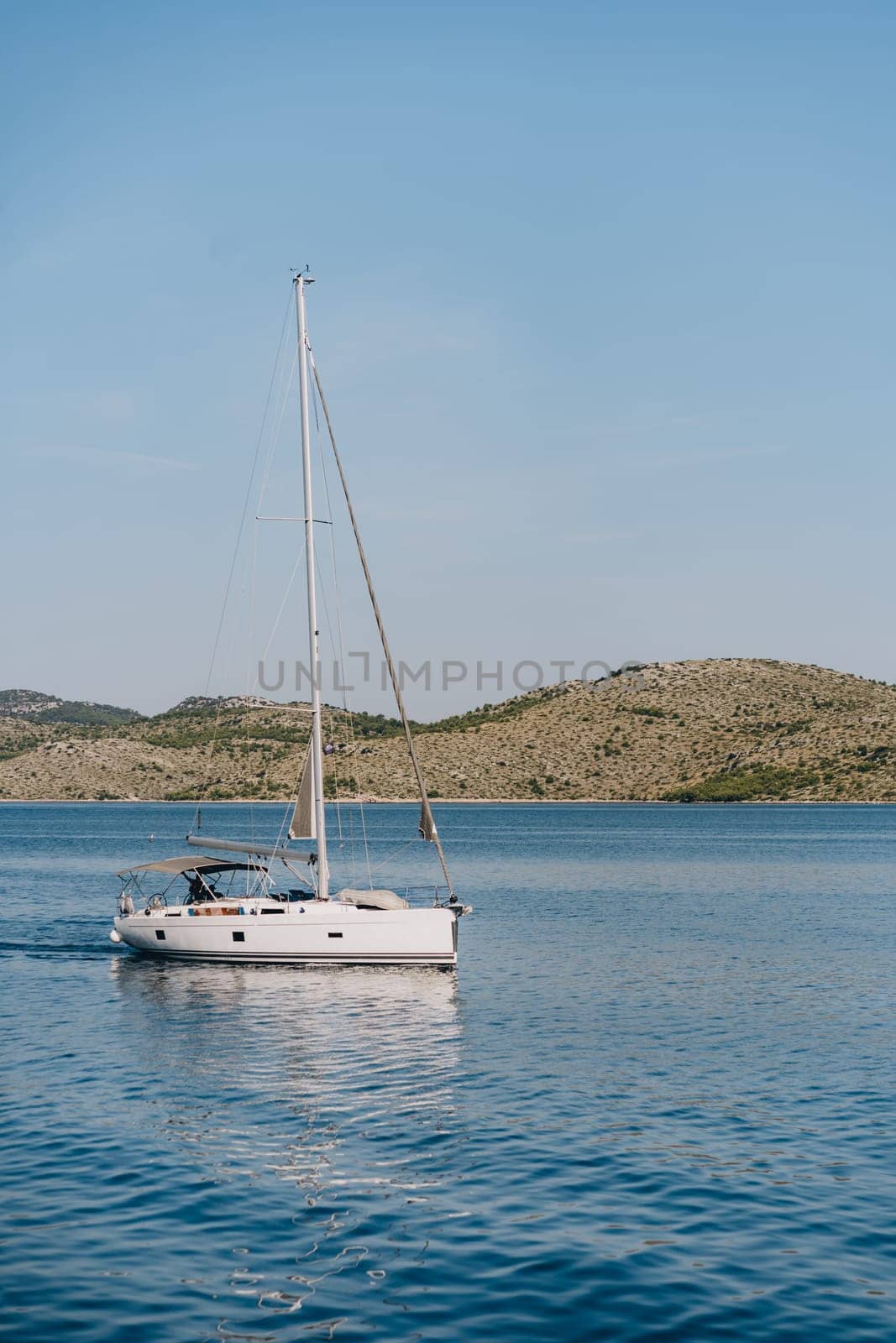 Scenic beauty of Dugi Otok island, sea with sailing yacht, Croatia by Popov