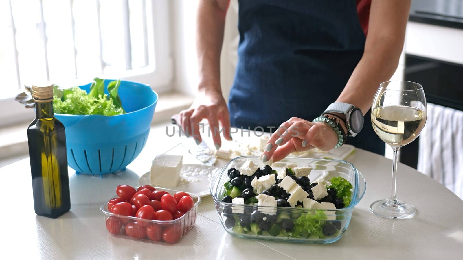 Housewife Puts Cheese In Bowl With Greek Salad Preparing Homemade Food