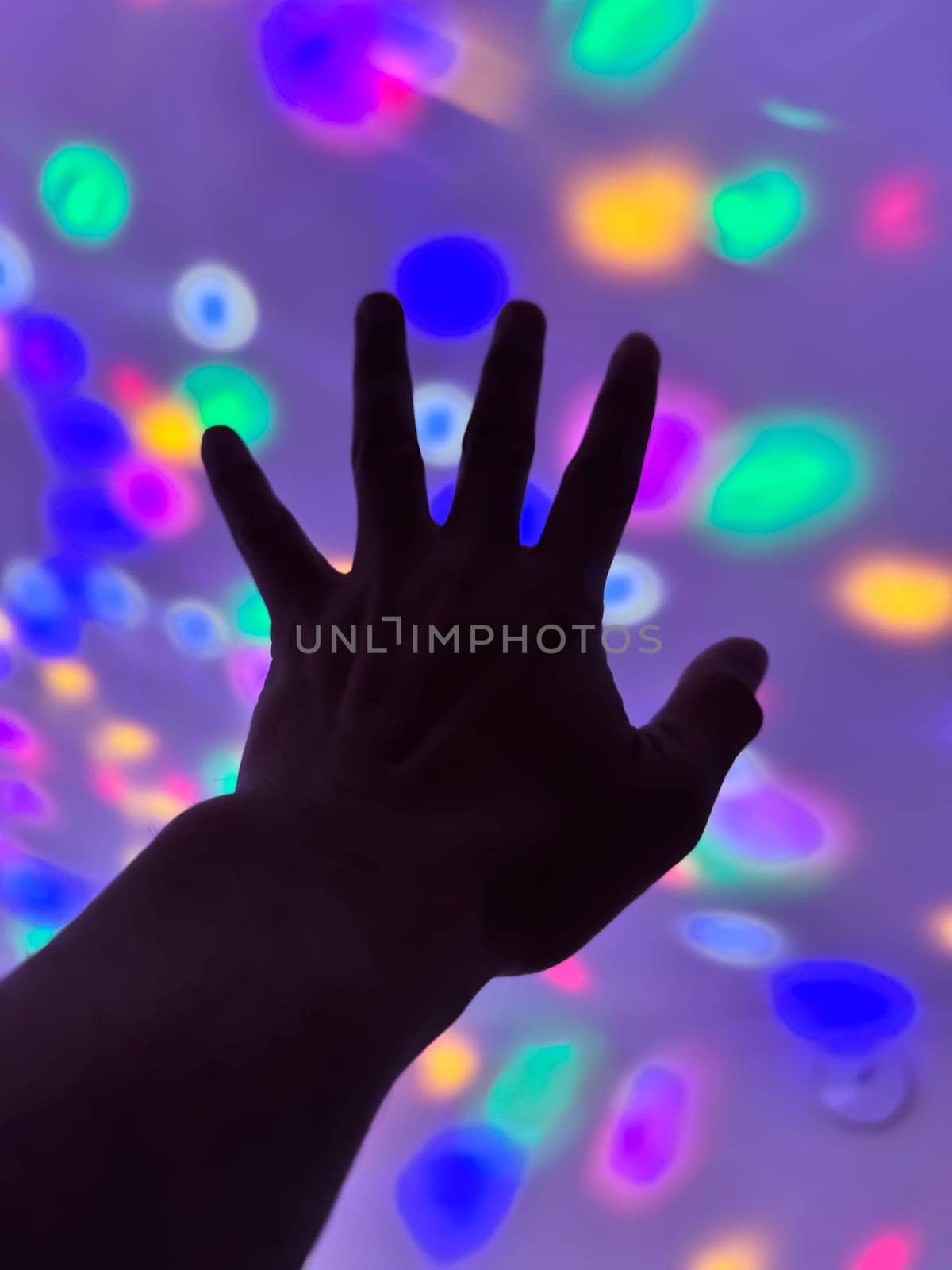 Hand gesture silhouette on a colorful background reaching out, saying hello, and show number represent for multimedia content creation