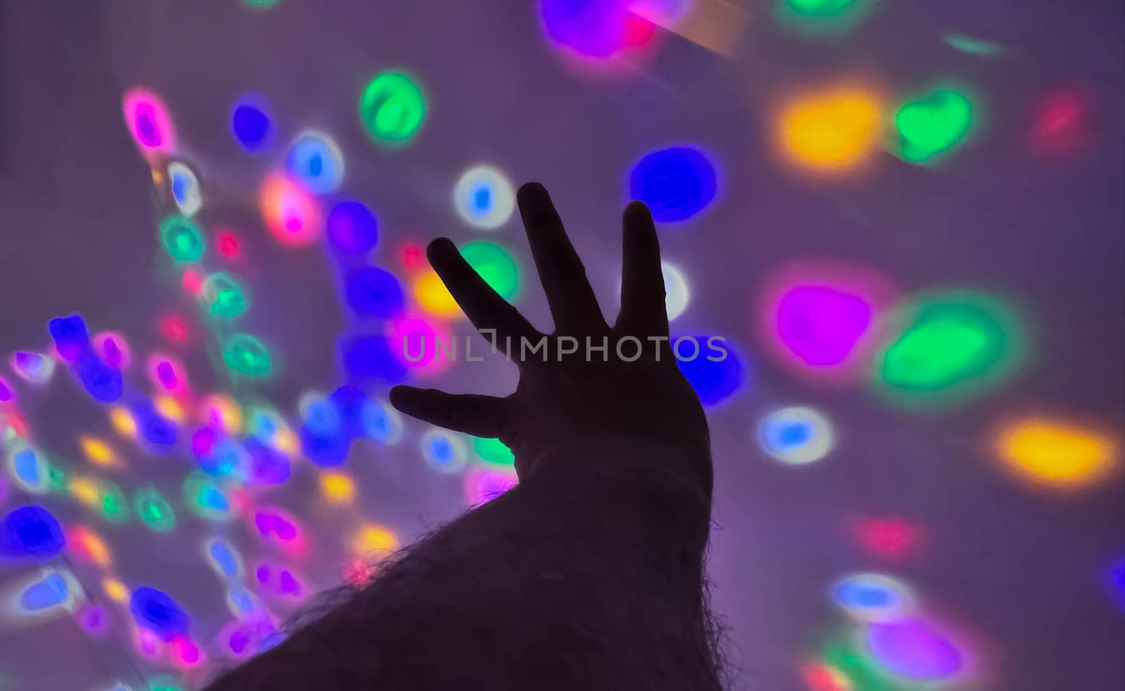 Hand gesture silhouette on a colorful background reaching out, saying hello, and show number represent for multimedia content creation