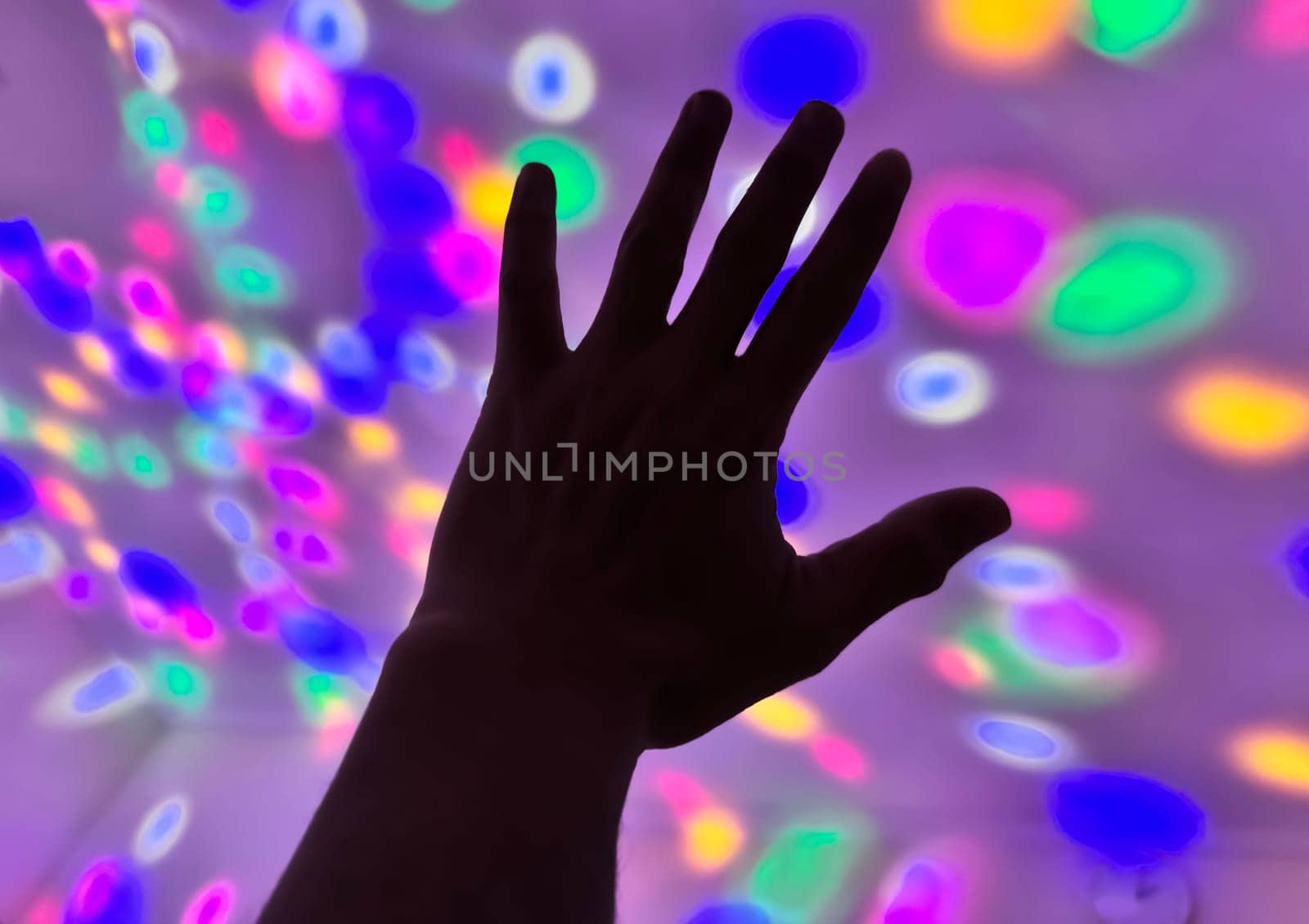 Hand gesture silhouette on a colorful background reaching out, saying hello, and show number represent for multimedia content creation