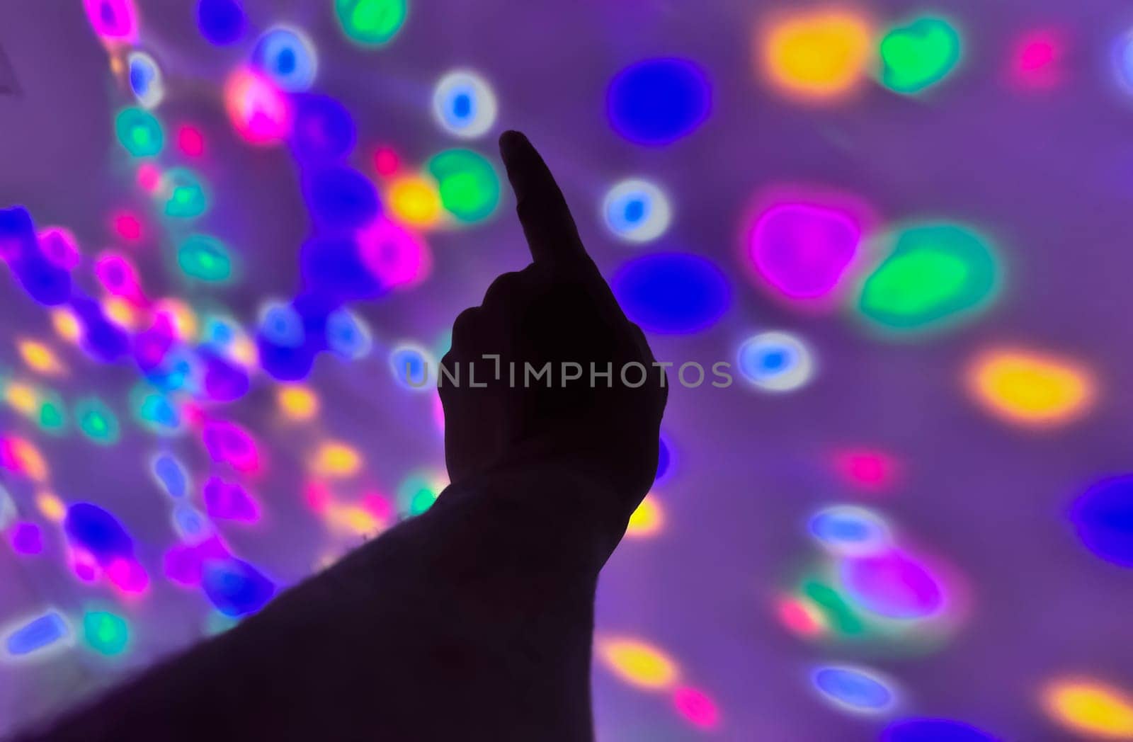 Hand gesture silhouette on a colorful background reaching out, saying hello, and show number represent for multimedia content creation