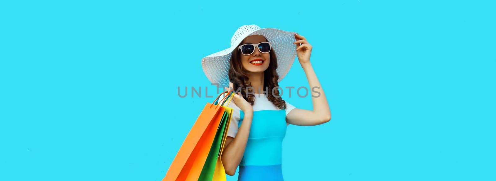 Shopping day! Stylish beautiful happy smiling young woman with shopping bags, wear summer hat by Rohappy