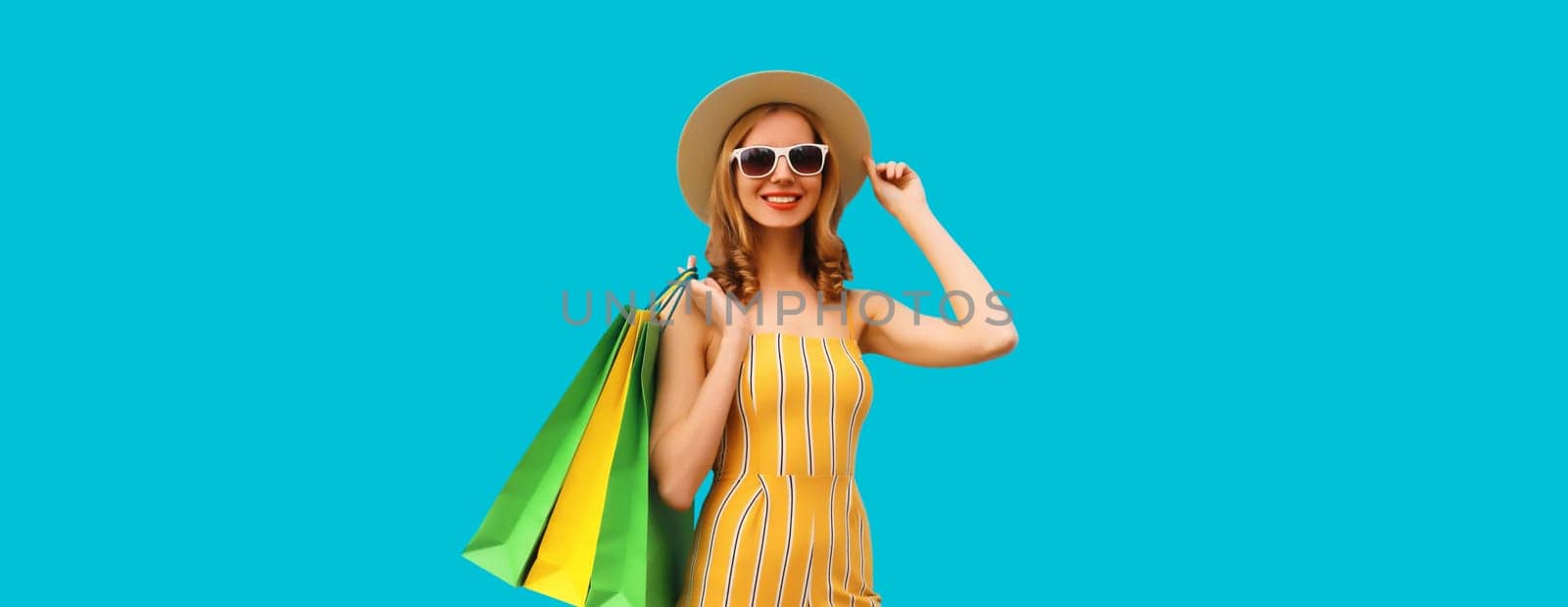 Shopping day! Stylish beautiful happy smiling young woman with shopping bags, wear summer hat by Rohappy