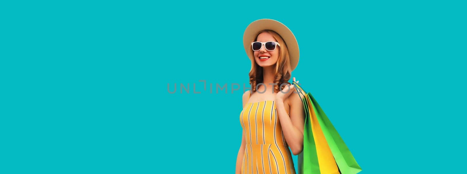 Shopping day! Stylish beautiful happy smiling young woman with shopping bags, wear summer hat by Rohappy