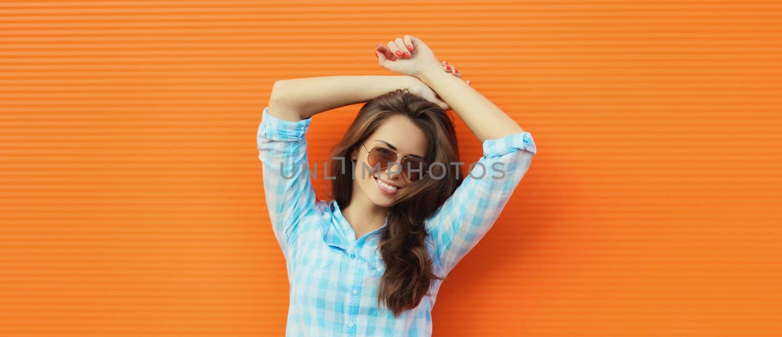 Portrait beautiful happy smiling brunette young woman posing in the city by Rohappy