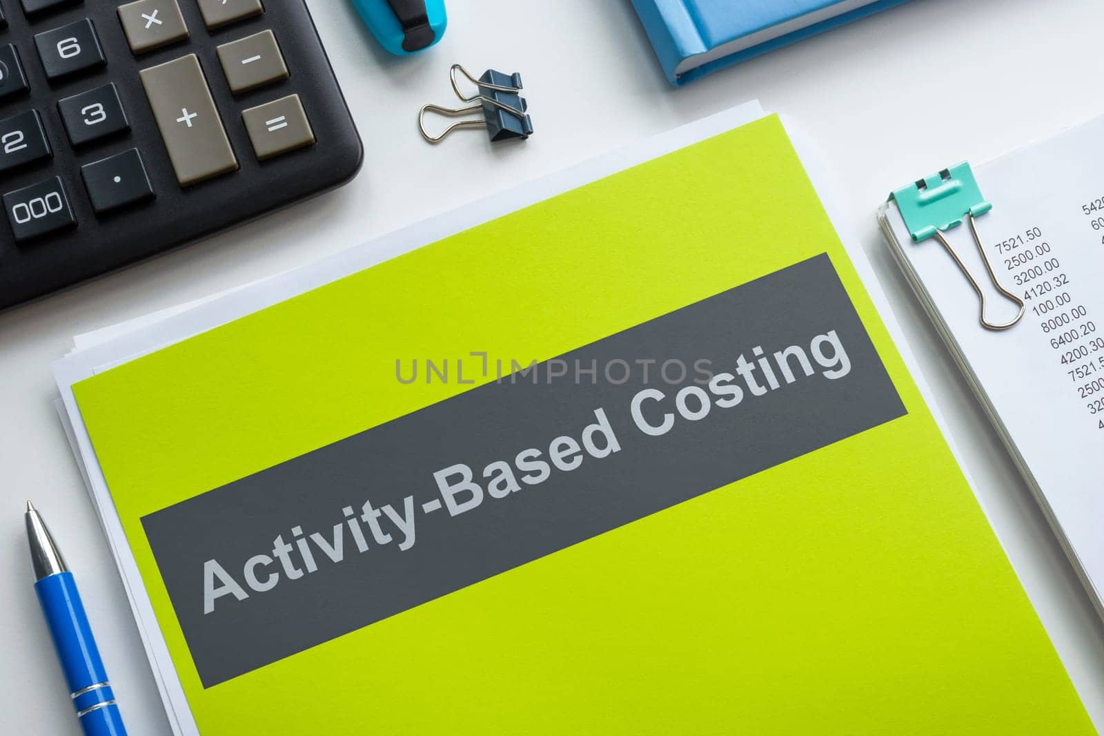 Book with Activity based costing and a pen.