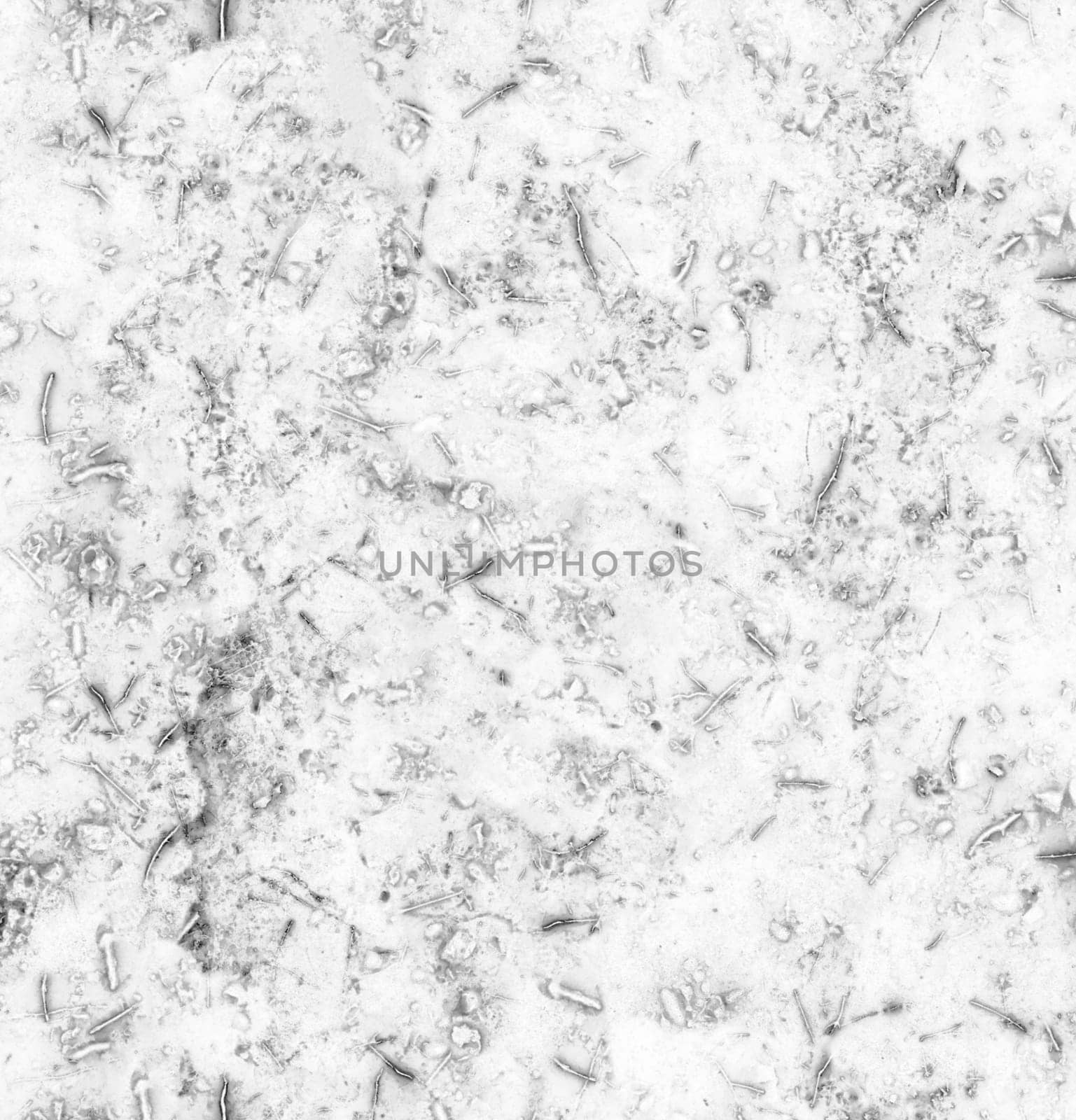 Abstract grey grunge-style background with fibers spots and dirt close-up from above