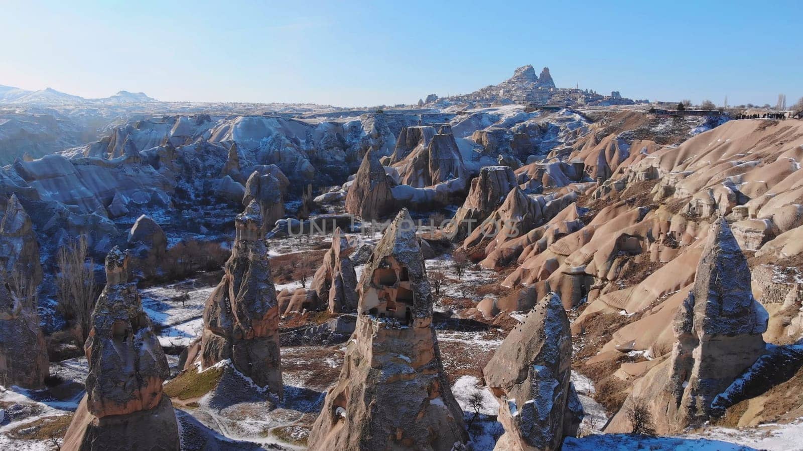 Panoramic view of fairy chimneys in Goreme Historical National Park. Goreme National Park and Rock Sites of Cappadocia, Central Anatolia, Nevsehir Province, Turkey. drone view. Ariel from above, top