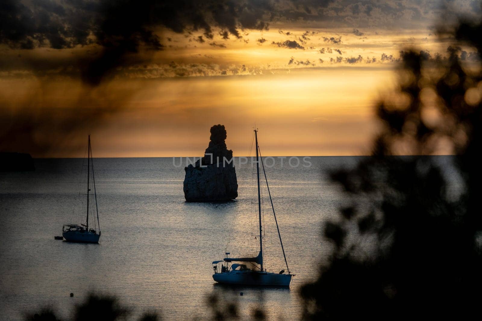 Sunset on Benirras beach in Ibiza in summer.