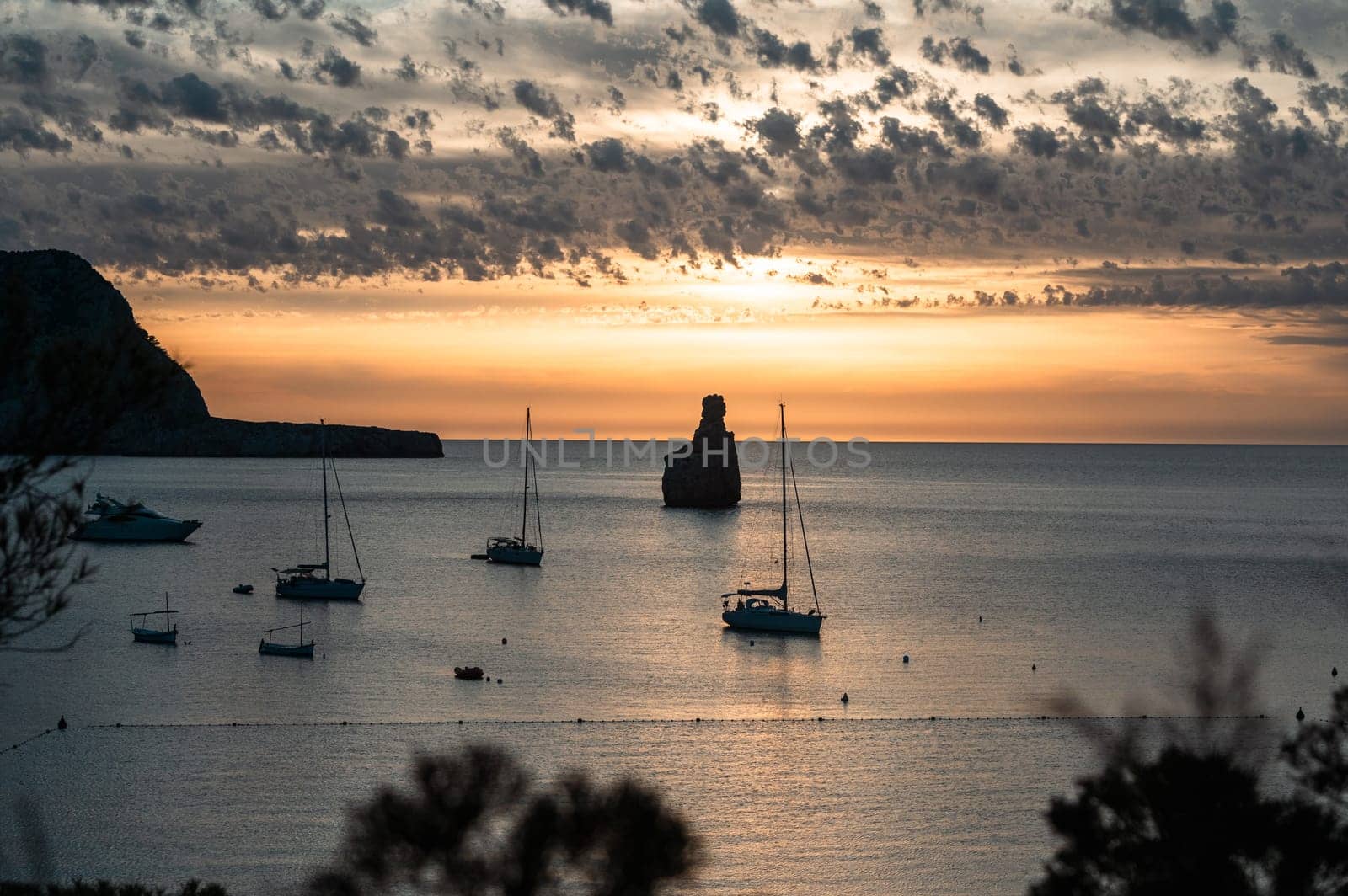 Sunset on Benirras beach in Ibiza in summer.