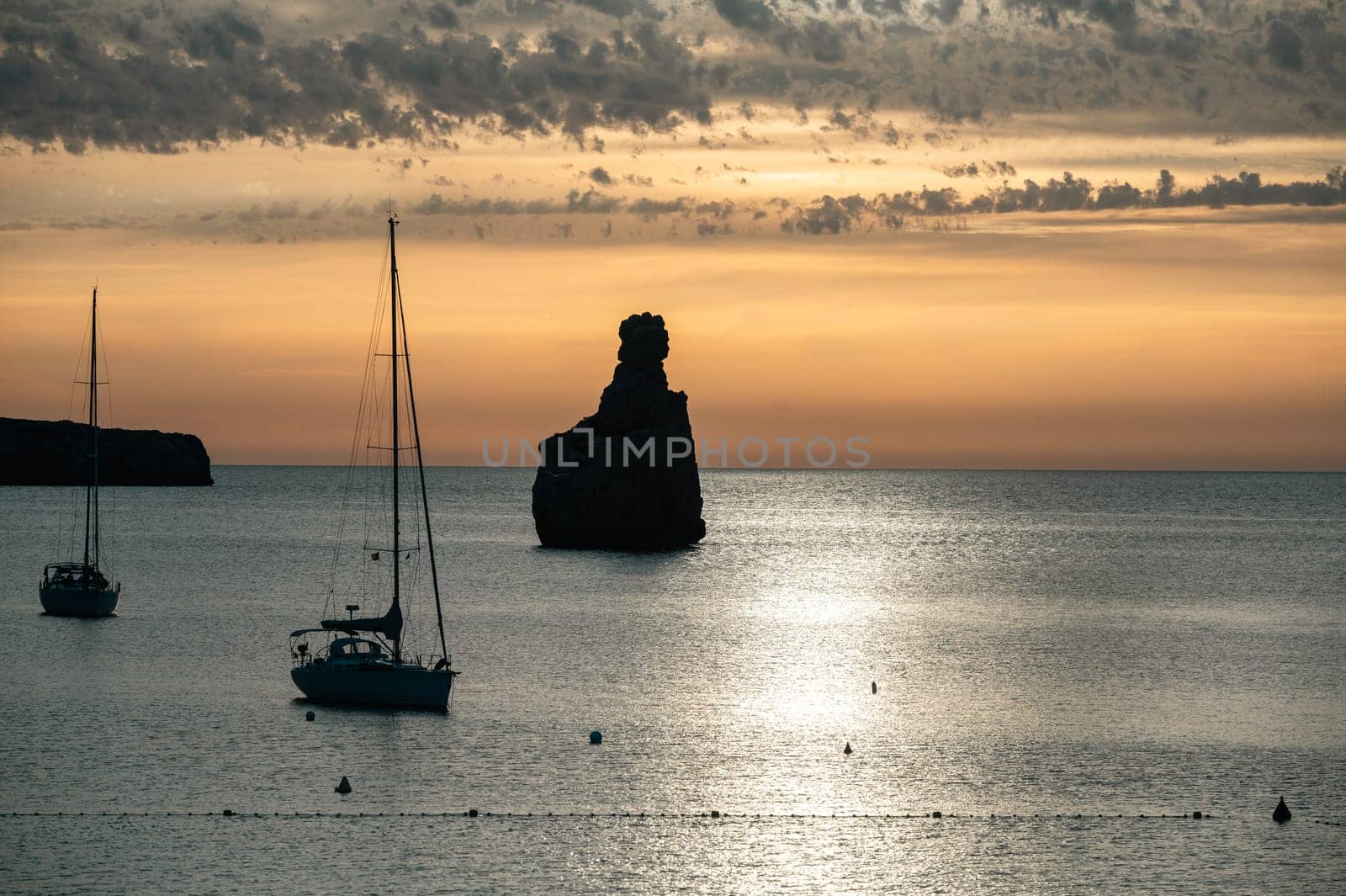 Sunset on Benirras beach in Ibiza in summer.