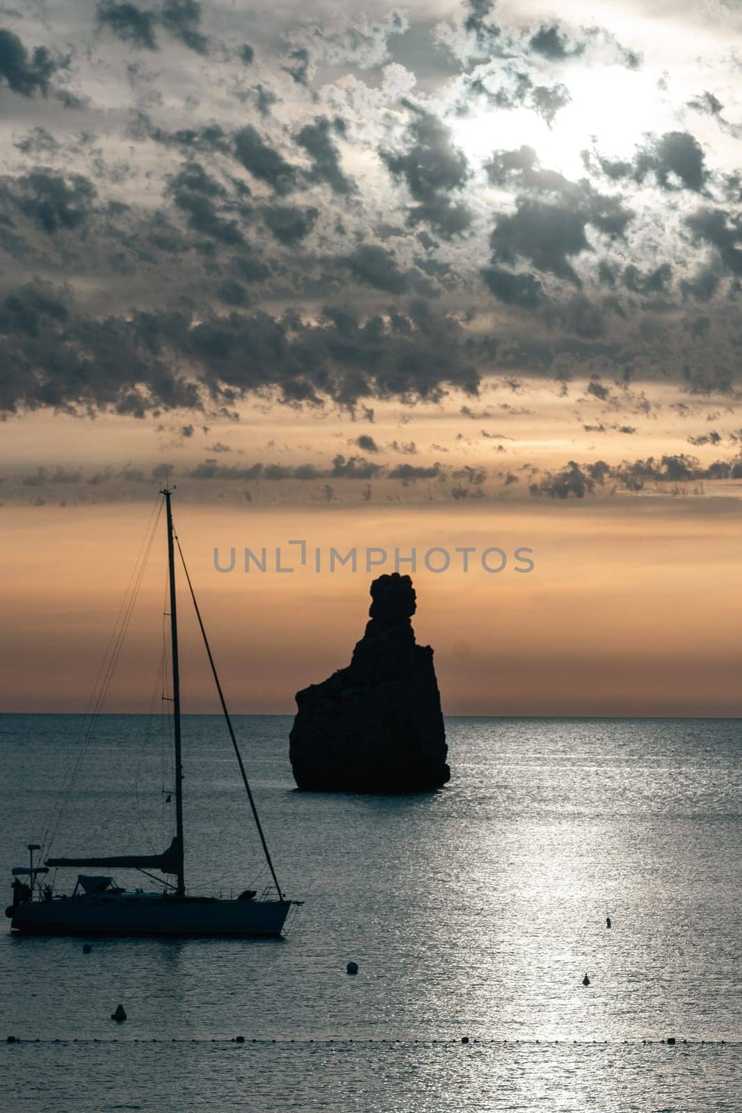 Sunset on Benirras beach in Ibiza in summer.