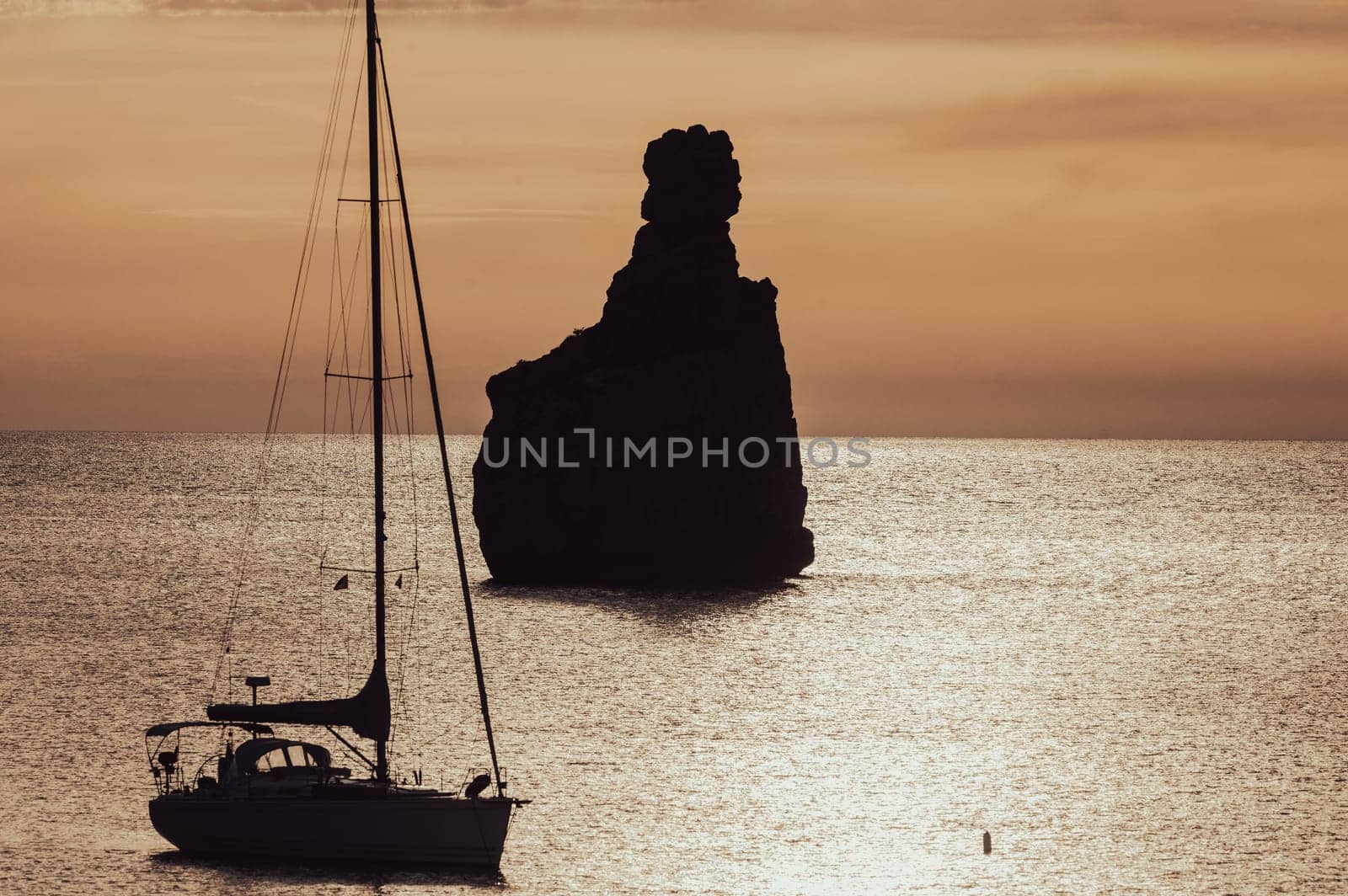 Sunset on Benirras beach in Ibiza in summer.